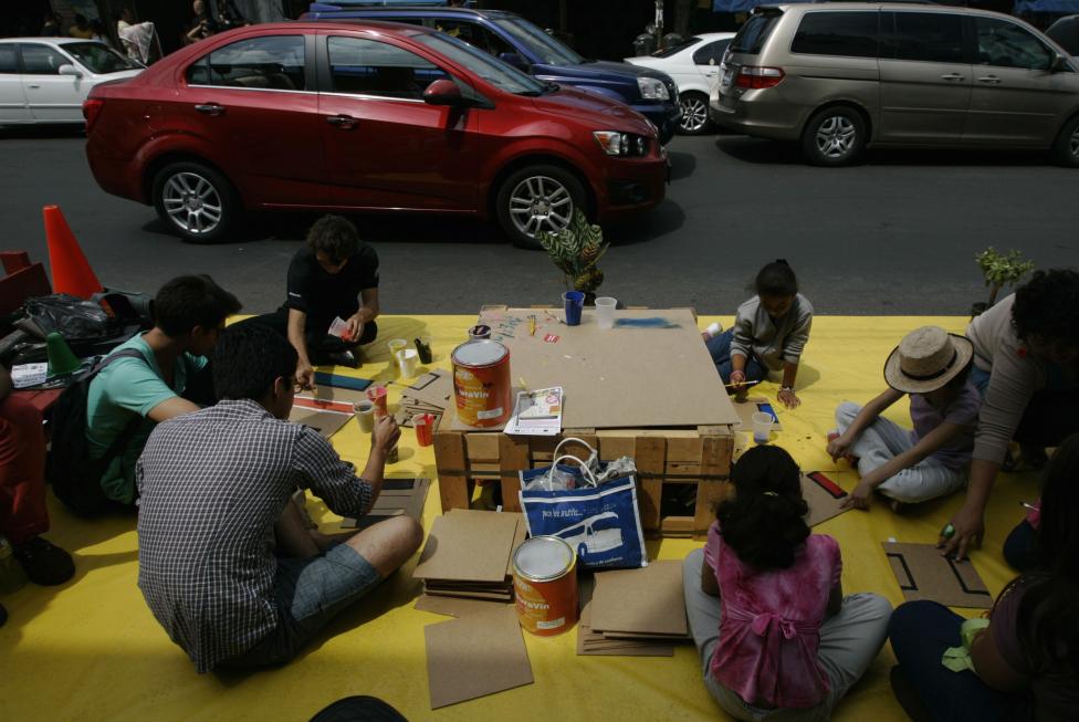 Children paint at a street during World Car Free Day in Guadalajara